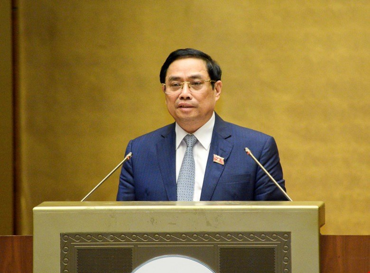 Thủ tướng Chính phủ Phạm Minh Chính trình bày tờ trình trước Quốc hội sáng 22/7.