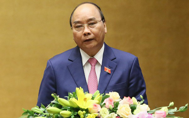 Thủ tướng Chính phủ Nguyễn Xuân Phúc trình bày Báo cáo về kết quả thực hiện kế hoạch phát triển kinh tế - xã hội năm 2019; kế hoạch phát triển kinh tế - xã hội năm 2020 trước Quốc hội. (Ảnh: Quang Vinh).